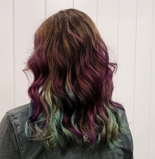 Plum and sea-green underlights beneath a bronde base